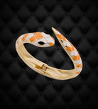 BKB Custom Gifts snake wrap bangle bracelet with orange and white enamel scales on a goldtone metal base