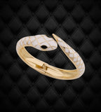BKB Custom Gifts white enamel snake wrap bangle bracelet with goldtone metal finish on a black quilted background